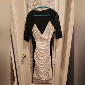 Kiyonna Black and White Ruched Sheath Dress with Plunge Neckline.